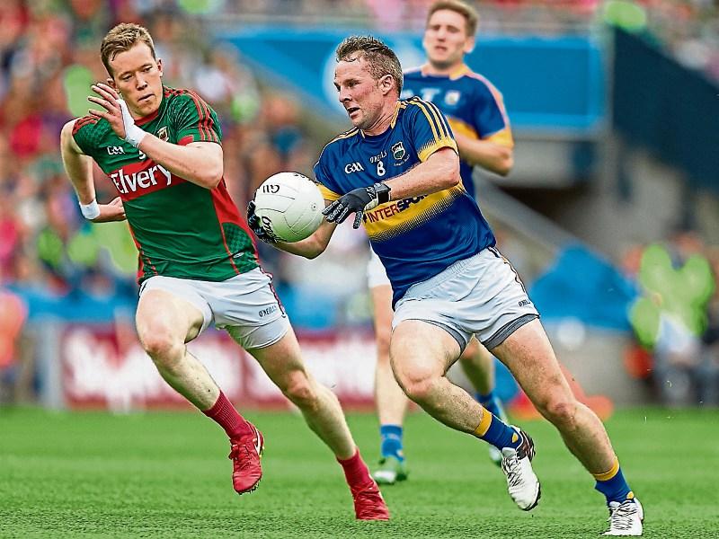 Tipp footballers do best when backs are to the wall says Dubai based former captain Peter Acheson