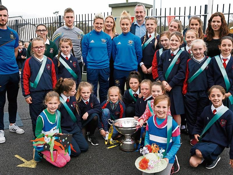 Carrick-on-Suir school celebrates the raising of its 6th Green Flag with GAA and music stars