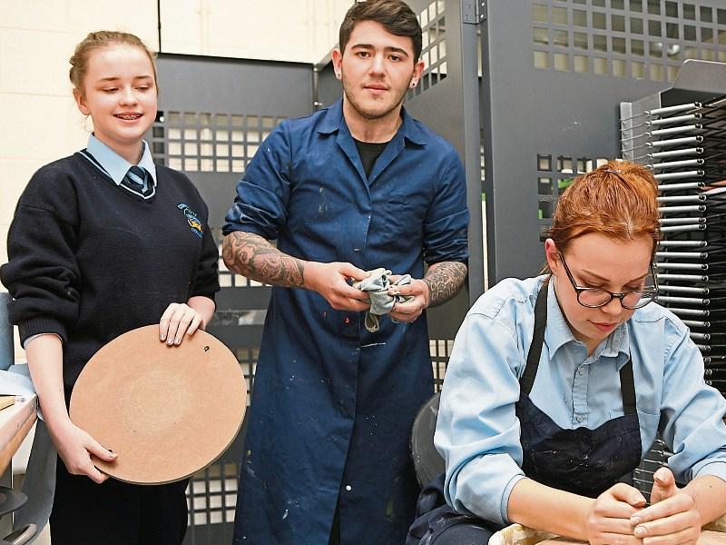 Comeragh College students Layla Keyes, Dean Walsh and Paulina Marlyniak giving a pottery demonstration at the school's open night.