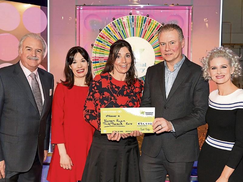 Noreen Ryan is presented with her winnings from last Saturday's Winning Streak show