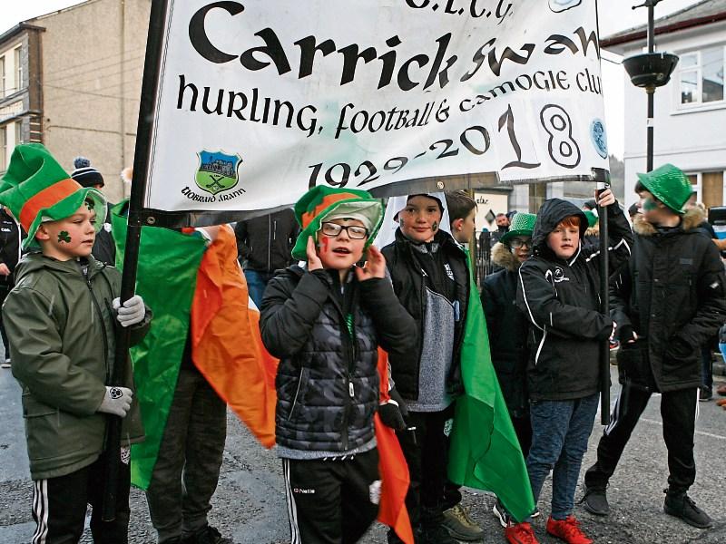 Young members of Carrick Swan GAA Club walking in Carrick-on-Suir's St Patrick's Day Parade, one of the beneficiaries of the grants. 