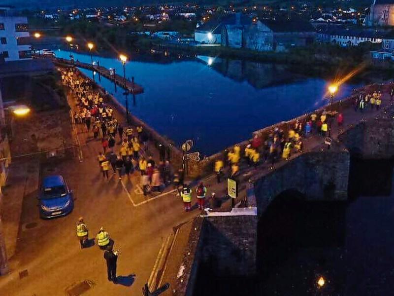 An aerial view of Darkness Into Light participants crossing the Old Bridge in Carrick-on-Suir last Friday morning.