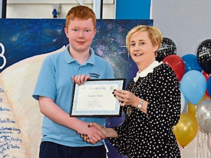 Miss Kathleen  O Donovan-Ryan, Second Year Head Teacher,  presenting an award to Tadhg Sheehan. 
