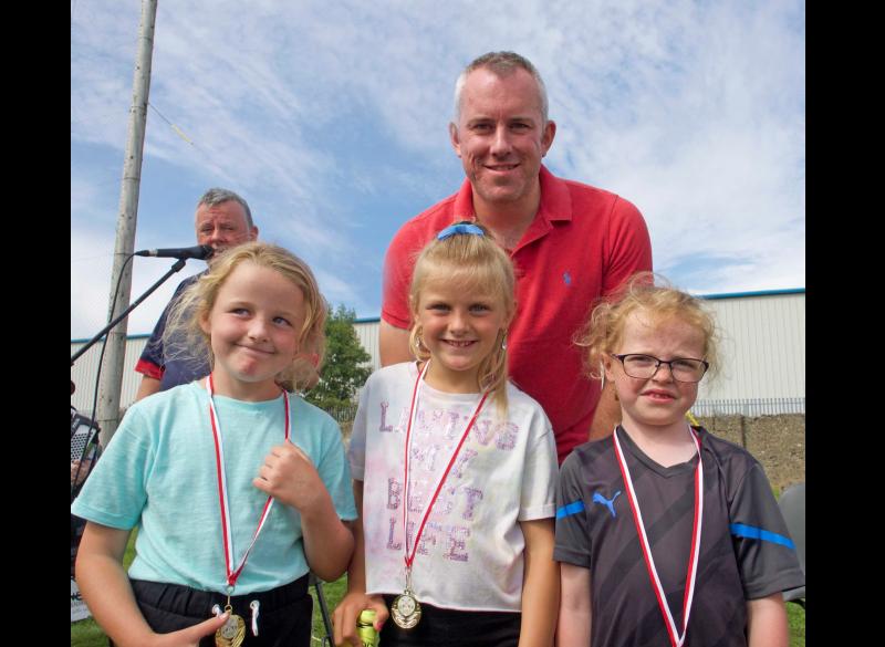 Special centenary medals presented to prize winners at Carrick Davins GAA Club Field Day 