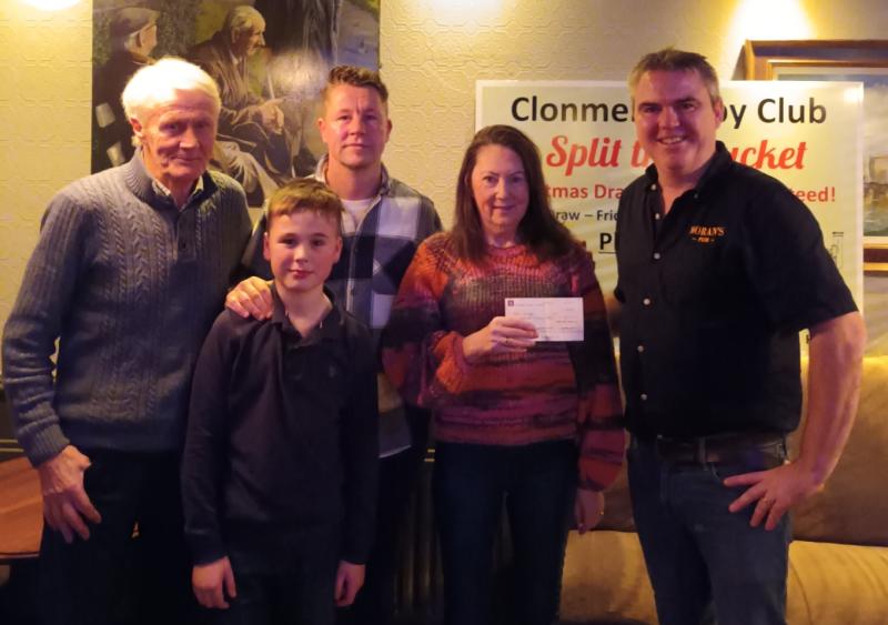 Three cheers for three generations as Kate splits the Clonmel Rugby Club bucket! 
