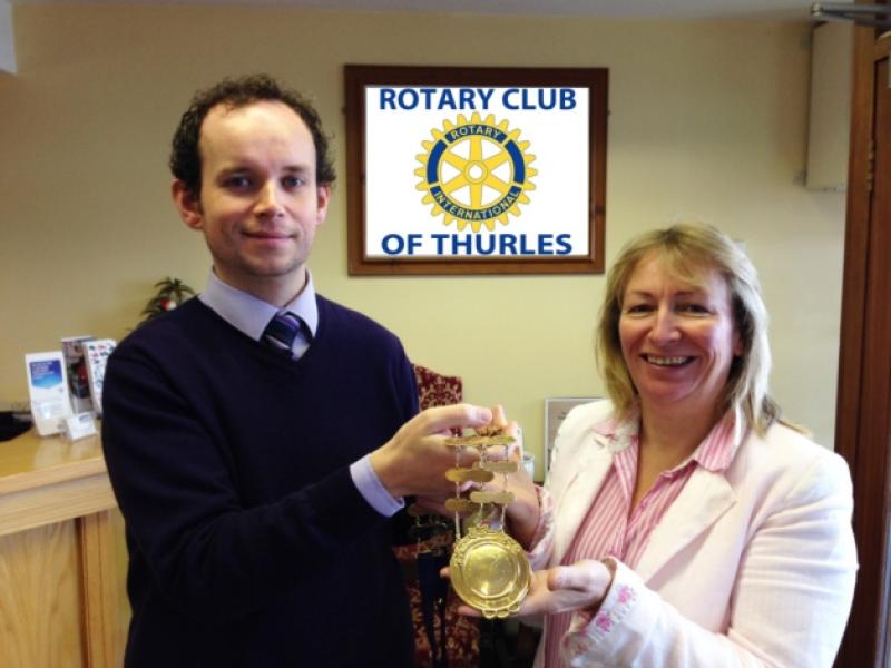 Jonathan Gleeson hands over the Chain of Office to Evelyn Nevin as Thurles Rotary President.