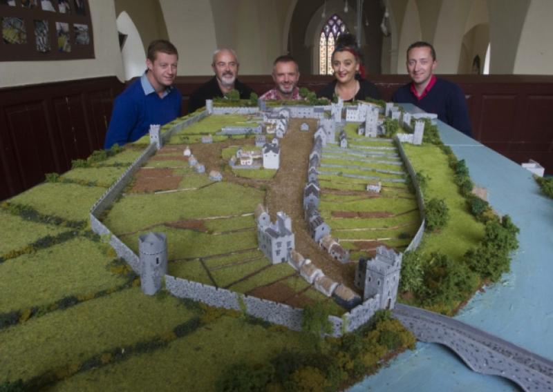 Helping to move the Medieval Fethard 3D Model from Holy Trinity Church of Ireland to the County Museum are L to R: John Cummins, Connie Sullivan, David Kirwan (Artisan Frames), Pat Looby and Justin McGree.