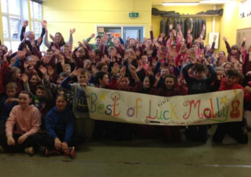 Pupils and staff of Kildangan National School, Puckane, with their banner supporting past pupil Molly Sterling