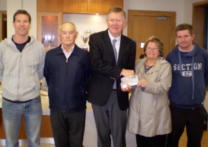 Joan Ryan presenting Derry McMahon, General Manager of Mooerhaven, Tipperary Town, with a cheque from monies raised at the David Ryan memorial football tournament. L to R: Peter Dewick, Jimmy Ryan (David�"s father), Derry McMahon, Joan Ryan and Dave Ryan