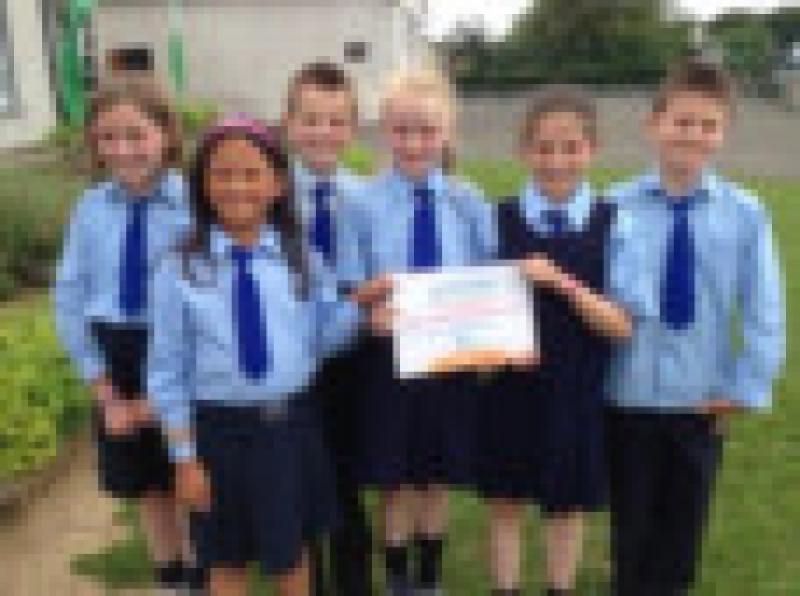 Second, Third and Fourth class pupils of  Inch NS, who have been awarded their fourth Discover Science and Maths Award of Excellence.