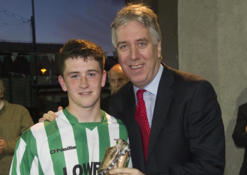 John Delaney (CEO FAI) presenting 'Man of the Match' award to Russell Quirke (St. Michaels), sponsored by Darren Ward Jewellers, Cahir.