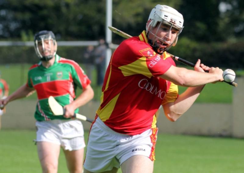 Joe O'Dwyer clears his lines for Killenaule watched by Loughmore's David Kennedy.  Picture: Bridget Delaney