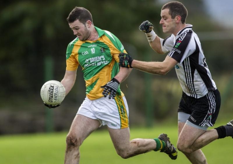 Barry Grogan (Aherlow Gaels) comes away from the challenge of Lorcan Egan (JK Brackens) in the County SFC semi-final.