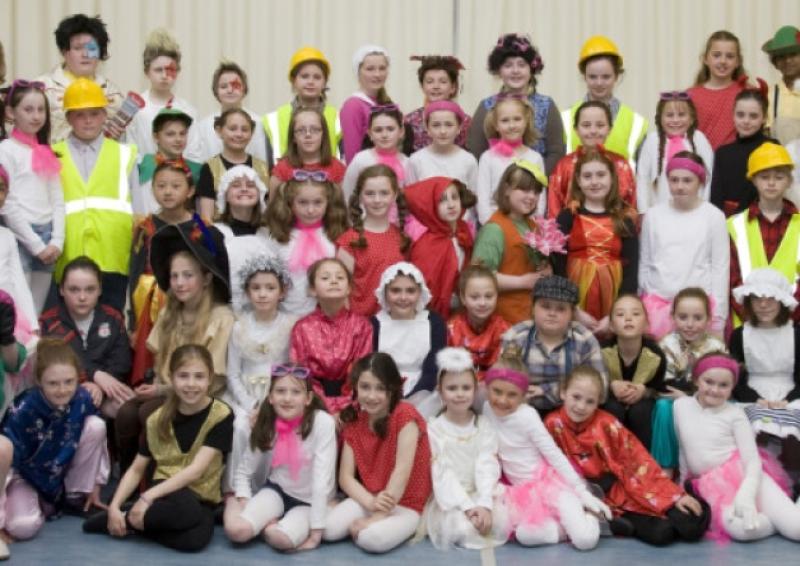 Third and fourth class i St. John the Baptist Girls School who recently won the  All-Ireland Cumann Scoildramaochta Inter-Schools Musical-Drama Competition in Mullingar are pictured with their teachers `l/R. Bernie Kennedy, Mary Andrews, (Principal)  and Gail Noonan.