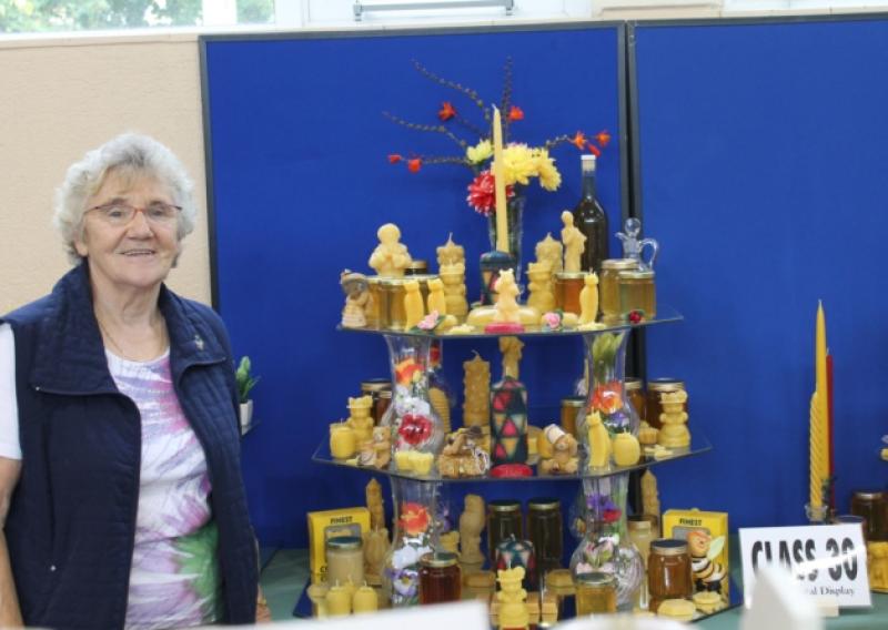 Bridie Power standing next to her prize winning best exhibit of the Show  for which she won the London Blue Ribbon Award