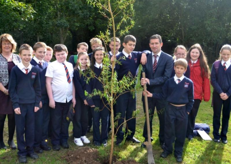 Staff and students at the tree planting to mark the opening of the Ardfinnan National School extension.