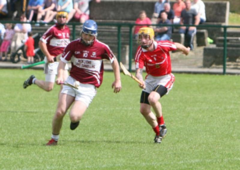 Ballingarrys Adrian Cleere heads off on a solo run with Pa Harris of Carrick Davins in close pursuit during Sundays South Senior Hurling Championship tie at Clonmel.