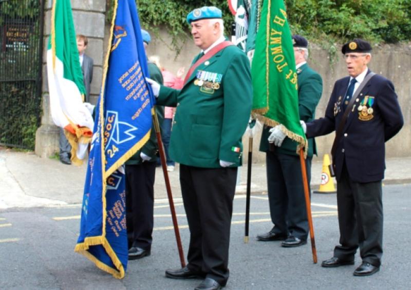 The Colour-Guard prepare to march through Tipperary town.