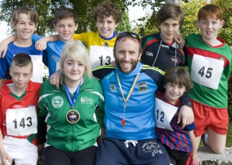 World Taekwondo Gold Medalist Shannon Strawbridge and race starter, Will Ryan, (principal St John the Baptist Boys school) and boys who le the race at the start pictured  before the off in last Sunday's Rock Run/Walk. Front L/R: TJ Baron, Adrian Gayson Molloy. Back L/R: Conor O'Dwyer, Jack McGrath, Ethan Gayson Molloy, Kevin Gayson Molloy, John Ryan.