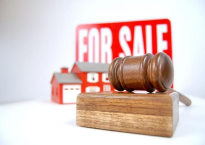 House auction concept shot with a sign, home and gavel
