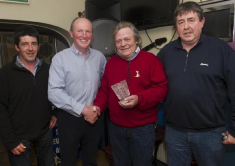Paul Kavanagh presenting the Butler's Bar Fethard Sports Achievement Award for April to horse trainer Mouse Morris. L to R: Stan Murphy (special guest), Paul Kavanagh, representing this month's sponsor 'United Colours of Benetton', Mouse Morris and Philip Butler.