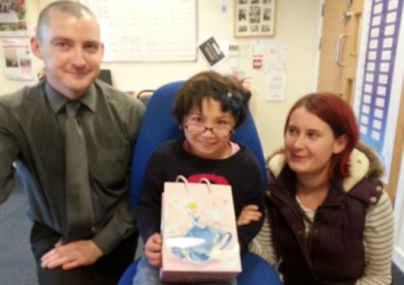 Amy Joyce and Sarah Jane Cleere with  Kieran Quirke, Manager in Provident, who ran a 10K in Limerick and raised over �800 for the "Amy 4 Disneyland" fund.