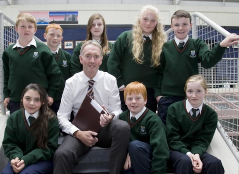 Pictured on their first day in Cashel Community School new principal John Gallagher and a representative group of students from the NS schools in the parish and district. Front L/R. Molly McGrath, Miche�l Quinlan, REbecca Farrell. Back L/R. Darragh Lacey, Jamie Duncan, Roisin Taylor, Cate Maher, Mark Keane.
