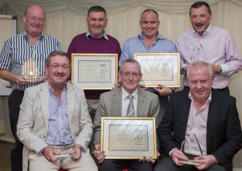 Kentz employees who were rewarded for their long service. Standing, Pat OShea, Tom Cullen, Shane Dooley Cullinane and John C. Walsh.  Seated, Martin Walsh, Richard Leonard and Michael Ross-Lonergan.