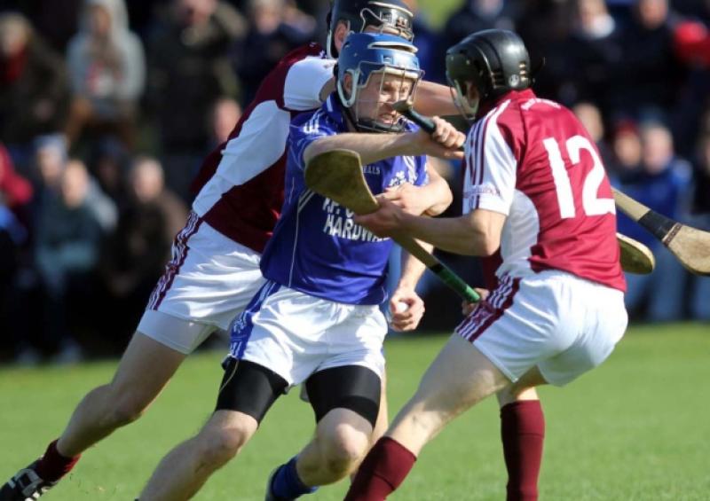 Annacarthy's Brian Fox holds possession despite the attentions of Borrisoleigh players Dan McCormack and Keith Ryan.  Picture: Bridget Delaney