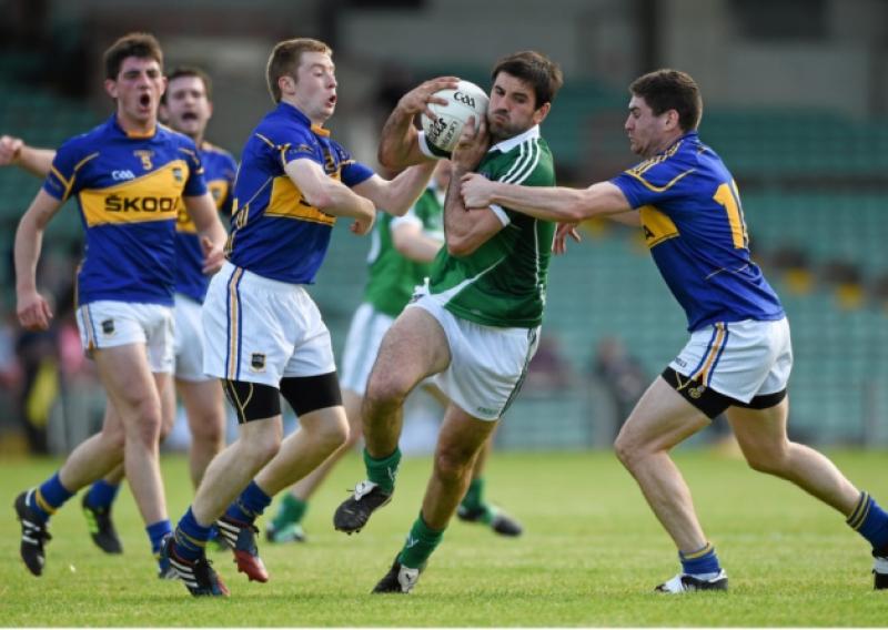 John Galvin, Limerick, in action against Brian Fox, left, and Philip Austin