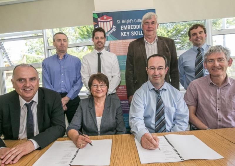 Pat Power Principal. Kay Morrissey, John Holohan, Peter Bluett, (back row l-r) Alan Guildea, Paul Nolan, John Bambrick and Nigel Cusack at the signing of the contract for the building of an extension and renovation of St Brigid's College in Callan. Photo: Pat Moore.