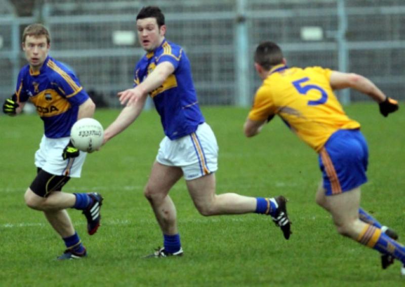 Tipp centre-forward Barry Grogan about to be challenged by Shane Hickey during Sundays National Football League Division 4 game against Clare at Semple Stadium. Brian Fox awaits developments. Picture: Bridget Delaney