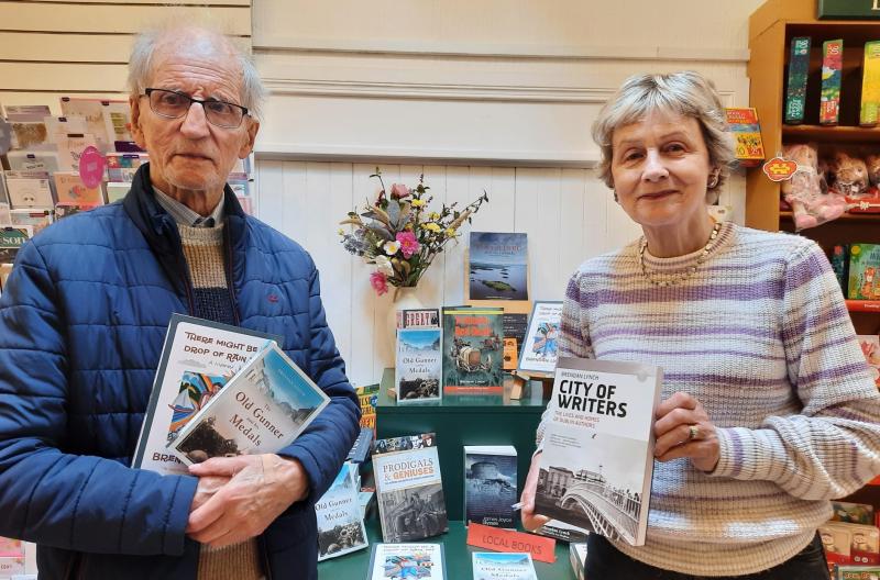 Toomevara writer Brendan Lynch with Catherine Ryan of Nenagh Bookshop where a window display marks the author’s birthday