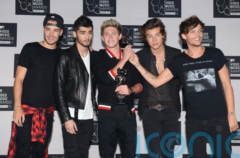 Louis Tomlinson hints at One Direction reunion
