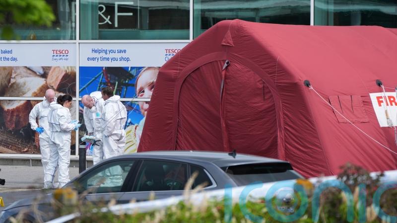 Man who died in supermarket shooting incident fired in the air as shoppers fled