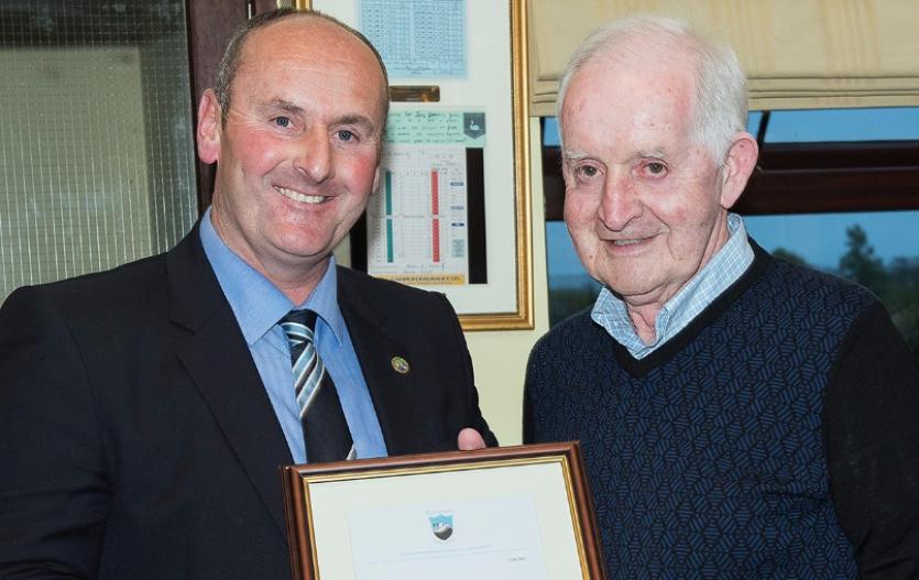 Captain Ed Kelly presenting Liam Cummins with his Honorary Life Membership of Rathdowney Golf Club for outstanding service given to the club.