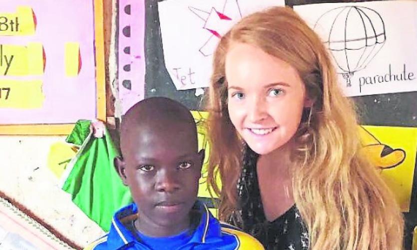 Maeve pictured in Uganda with a new Tipperary Supporter!