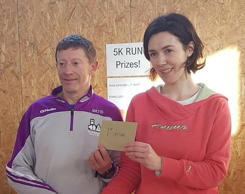 Willie O'Donoghue accepting his prize after winning the Scoil Mocheallog 5k in Kilmallock last Sunday