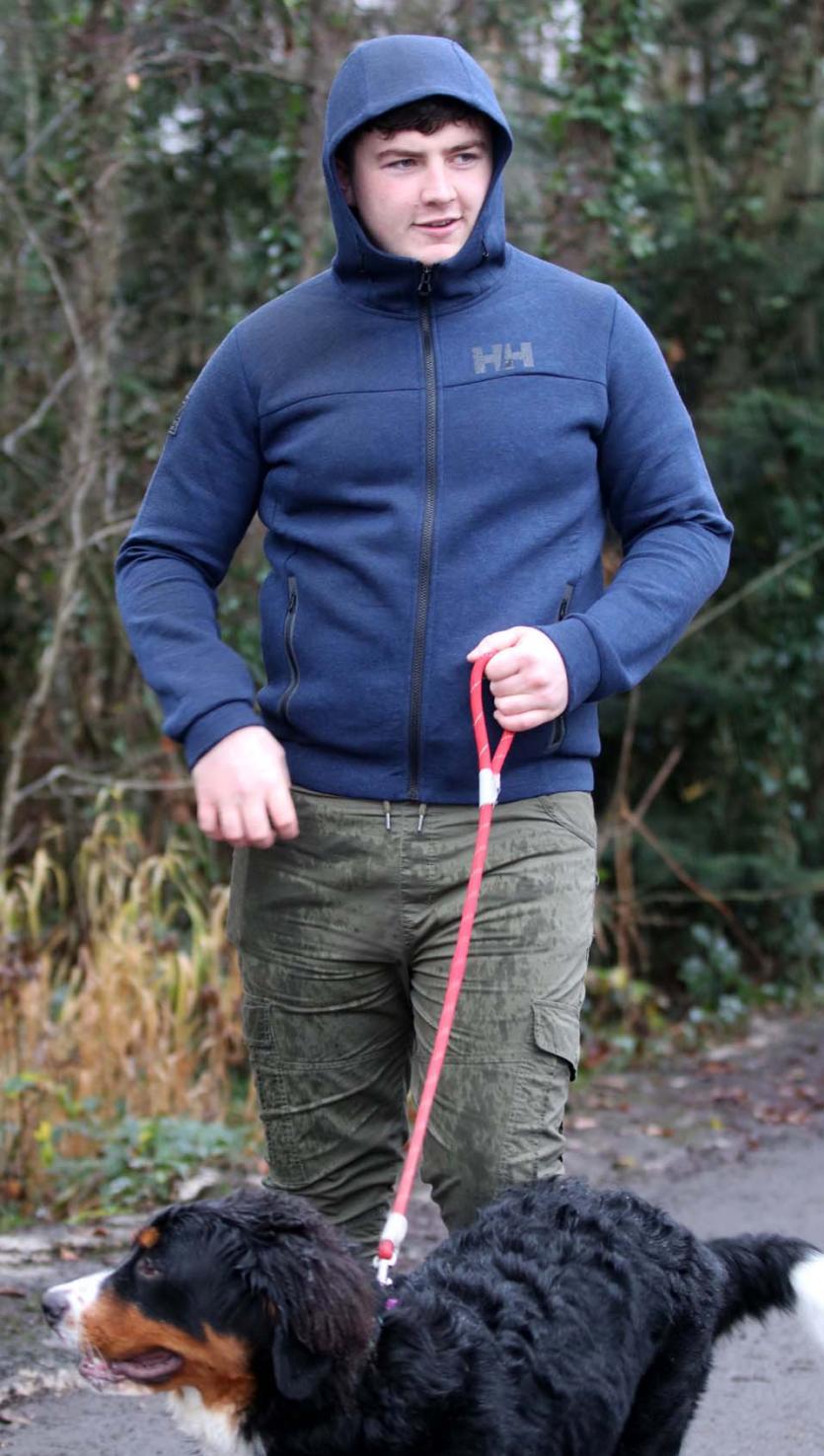 Jack O'Keeffe walking the family dog in Youghal Quay to watch the swimmers at Christmas.  Picture: Bridget Delaney